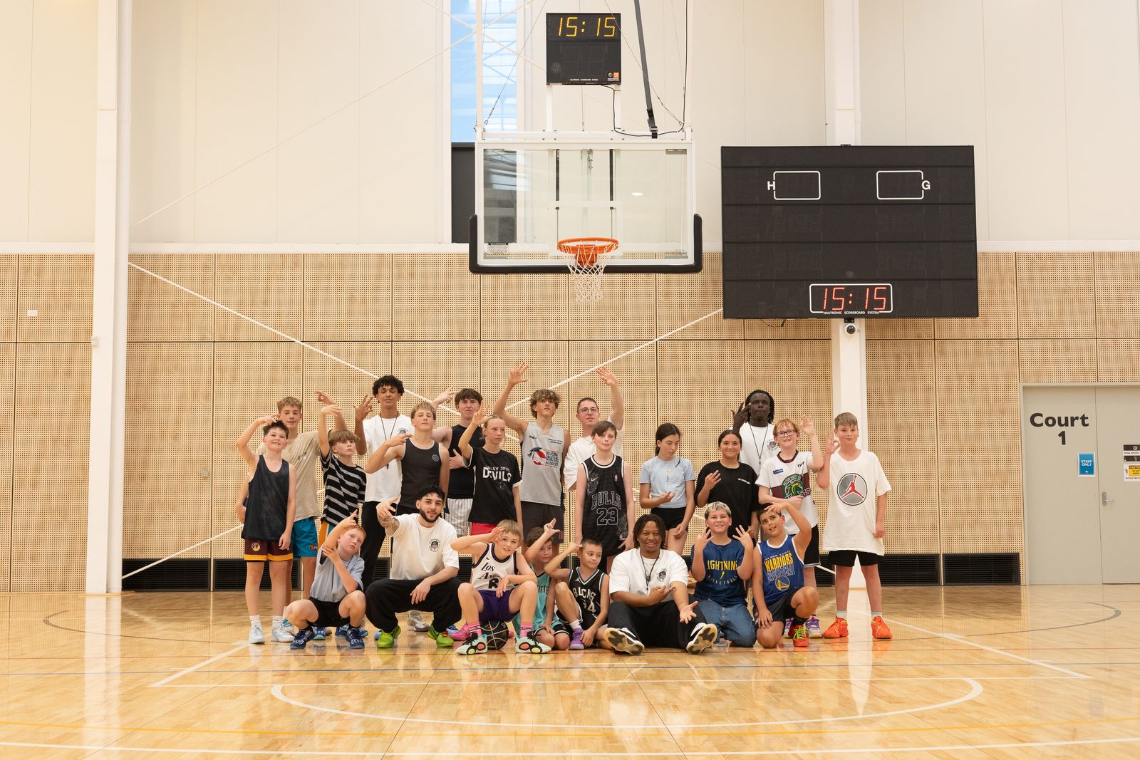 Players and coaches posing together after a session