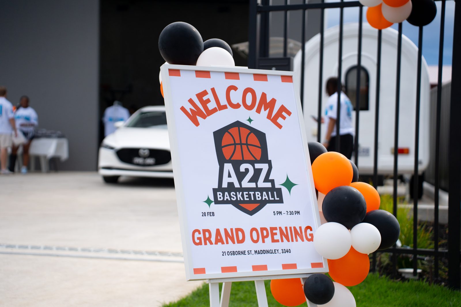 A2Z Basketball grand opening welcome sign with balloons
